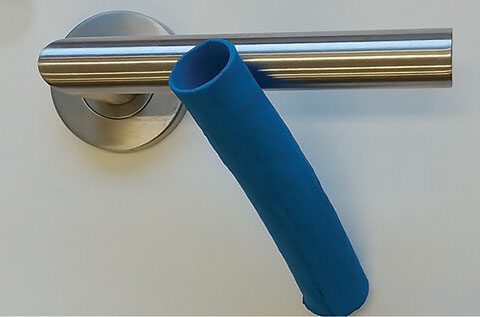 Photograph of the door handle cover made of polyurethane film with UiO-66 microparticles loaded with iodine